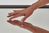 An image showing a hand touching a surface