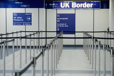 An image showing a room with the UK border sign visible