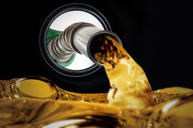A petrol pump refilling a fuel tank